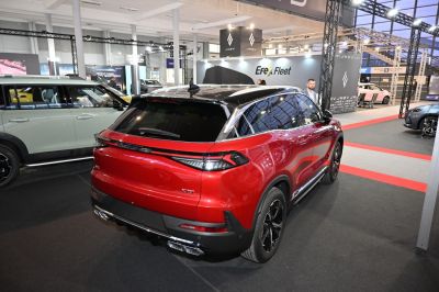 Red SUV rear with black roof, LED taillights, and quad exhaust tips