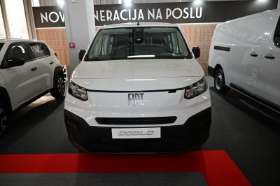Front view of a modern white commercial van with distinctive headlights and grille.