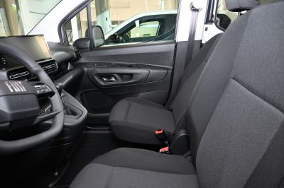 Front interior seats and dashboard with fabric upholstery and control panel