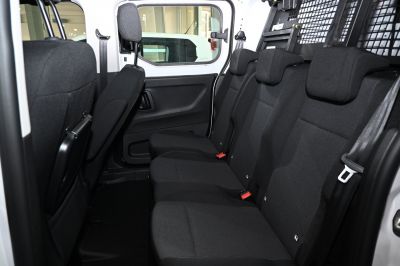Rear interior with three black fabric seats and spacious passenger area