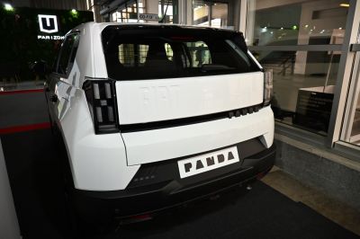 Rear view with black panel, embossed logo, and modern tail lights