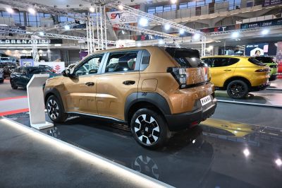 Rear side view of a compact SUV with angular body design and modern wheels