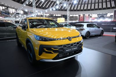 Front grille and LED headlights of a modern yellow SUV