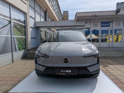 Front view of a compact electric vehicle with sleek LED headlights and minimalist grille