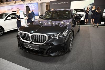 Front view with prominent grille and sleek headlights