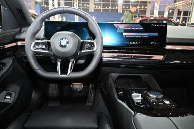 Digital dashboard and multifunction steering wheel in luxury sedan interior