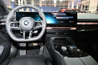 Digital dashboard and multifunction steering wheel inside a modern car interior