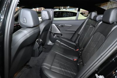 Luxurious black leather rear seats with modern stitching and comfort features