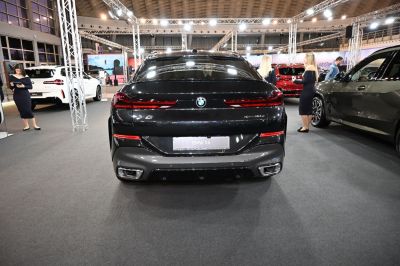 Rear view of BMW SUV with sleek tail lights and dual exhausts