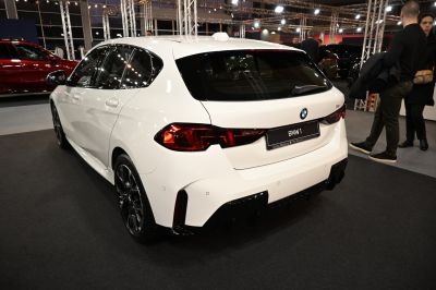 Rear view of modern hatchback with LED tail lights and sporty black accents