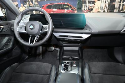 Modern BMW steering wheel and dashboard with digital display