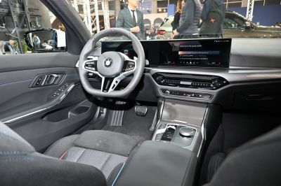 dual digital screens and multifunction steering wheel inside a modern sedan