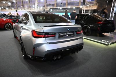 Rear view of a sport sedan with quad exhaust and LED taillights