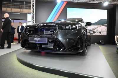 Black car front view with kidney grille and LED headlights