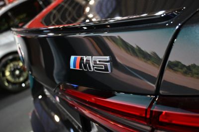 Close-up of BMW M5 G90 rear badge and taillight
