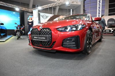 Red convertible front with large grille and LED headlights