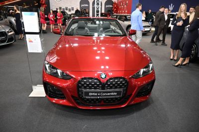 Front view of red convertible with kidney grille and LED headlights
