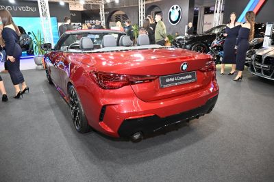 Red convertible rear view with LED taillights and dual exhaust