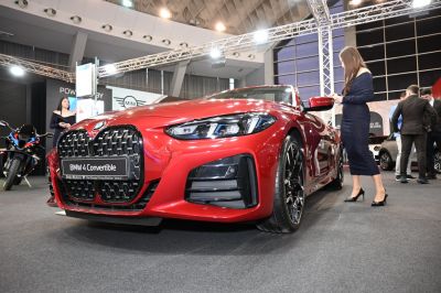 Close-up of a red convertible front grille and headlights
