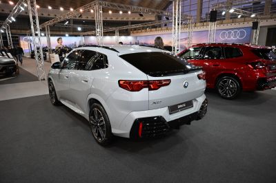 Rear and side view of a modern sporty SUV with distinctive taillights and black roof accents