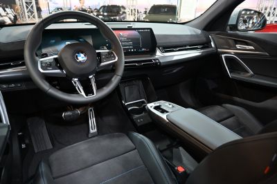 Digital instrument cluster and modern steering wheel in car interior