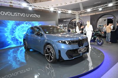 Sleek electric SUV with aerodynamic front and large alloy wheels