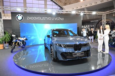Front grille and sleek SUV design on showroom platform