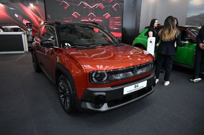 Front view of a modern electric crossover with distinctive lighting.