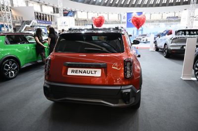 Rear view of a modern electric vehicle with distinctive taillights and sleek rear design.