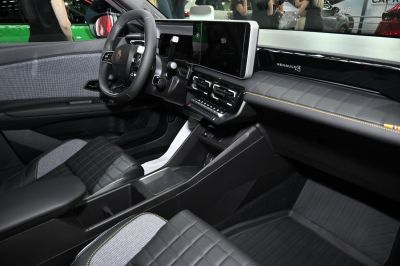 Modern car interior with digital dashboard and quilted seats
