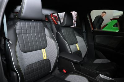 Quilted leather and fabric front seats with yellow accent stitching
