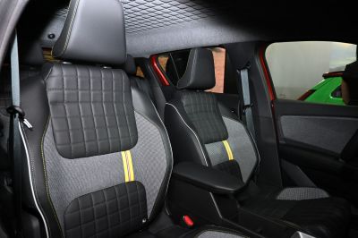Quilted and patterned front seats with contrast stitching and armrest