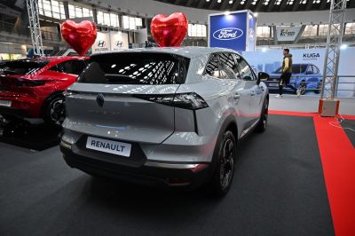 Rear view of a modern electric crossover with distinctive tail lights and aerodynamic shape