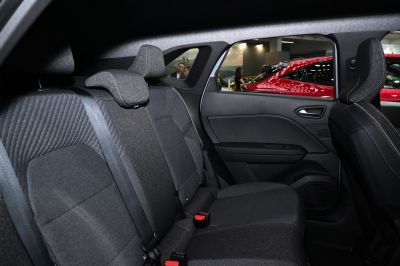 Detailed rear seat upholstery and door panel in car interior