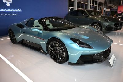 Low-profile aerodynamic roadster with modern headlamps and intricate alloy wheels