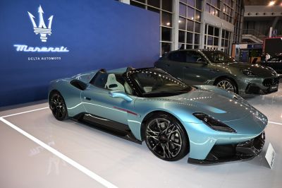 Blue luxury convertible roadster with sporty design and black wheels