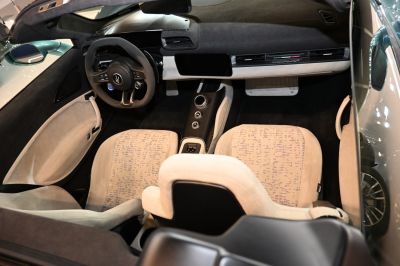 Carbon fiber steering wheel and digital dashboard with patterned luxury seats