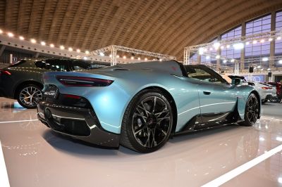 Rear profile with sleek aerodynamic curves and sporty multi-spoke wheels