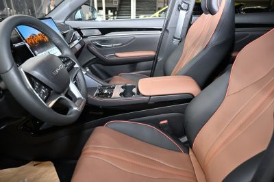 Leather seats and digital dashboard with touchscreen in car interior