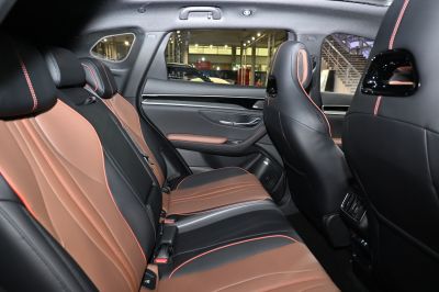 Two-tone rear seats with orange stitched leather upholstery