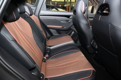 Two-tone leather rear seats with orange stitching and rear air vents