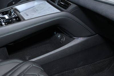 Center console with USB ports and wireless charging pad