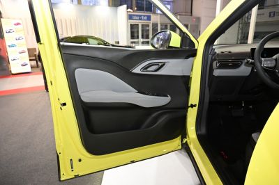Modern two-tone interior door panel with ergonomic armrest