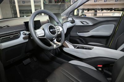 Modern steering wheel and sleek center console inside car