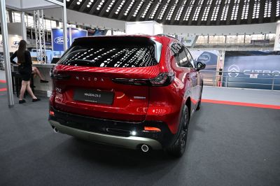 Sleek rear view with distinct tail lights and dual exhaust pipes