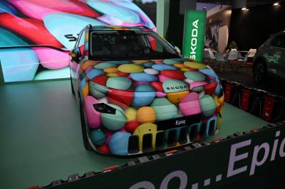 Front view of vehicle with colorful pebble-pattern wrap