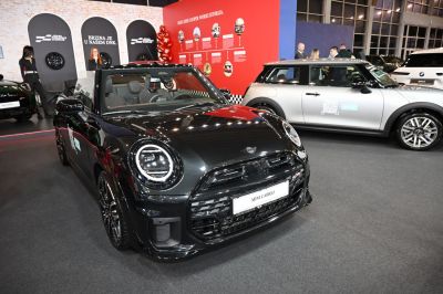 Front view of black convertible with round LED headlights