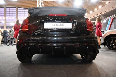 Folded soft top roof and rear taillights of a compact convertible