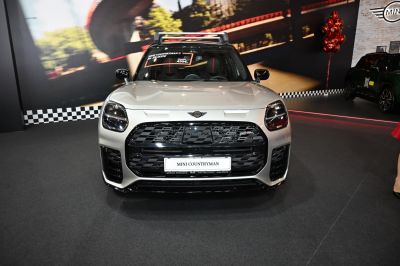 Front view with distinctive headlights and bold black grille.