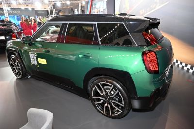 Side and rear view of green Mini Aceman with alloy wheels